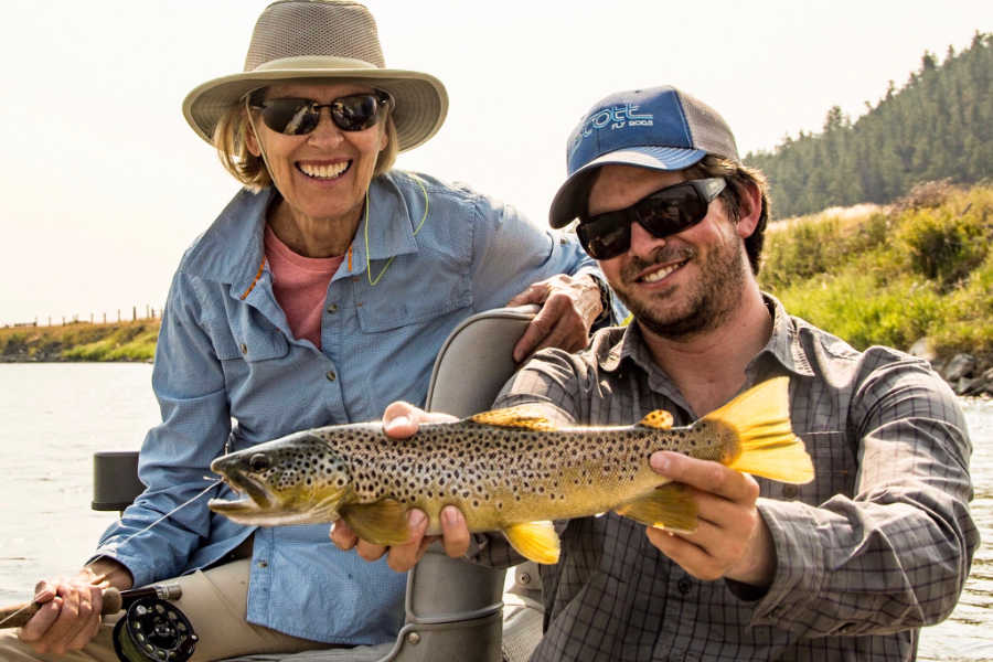 Angler and guide with a brown trout on the Yellowstone River