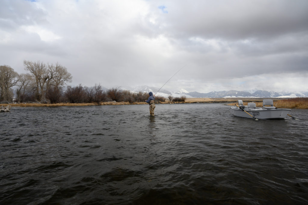 Angler fly fishing Montana in March