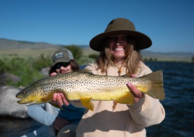 Angler showing off a Madison River Brown Trout