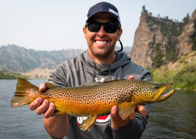 Angler with a trophy brown trout on Montana's Missouri River