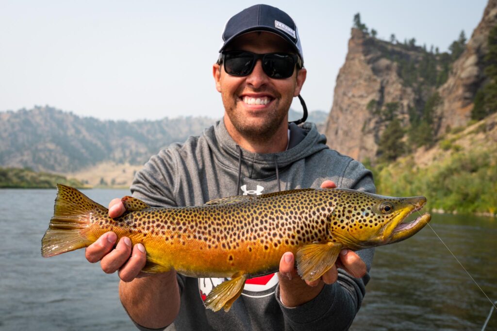 Angler with a trophy brown trout on Montana's Missouri River