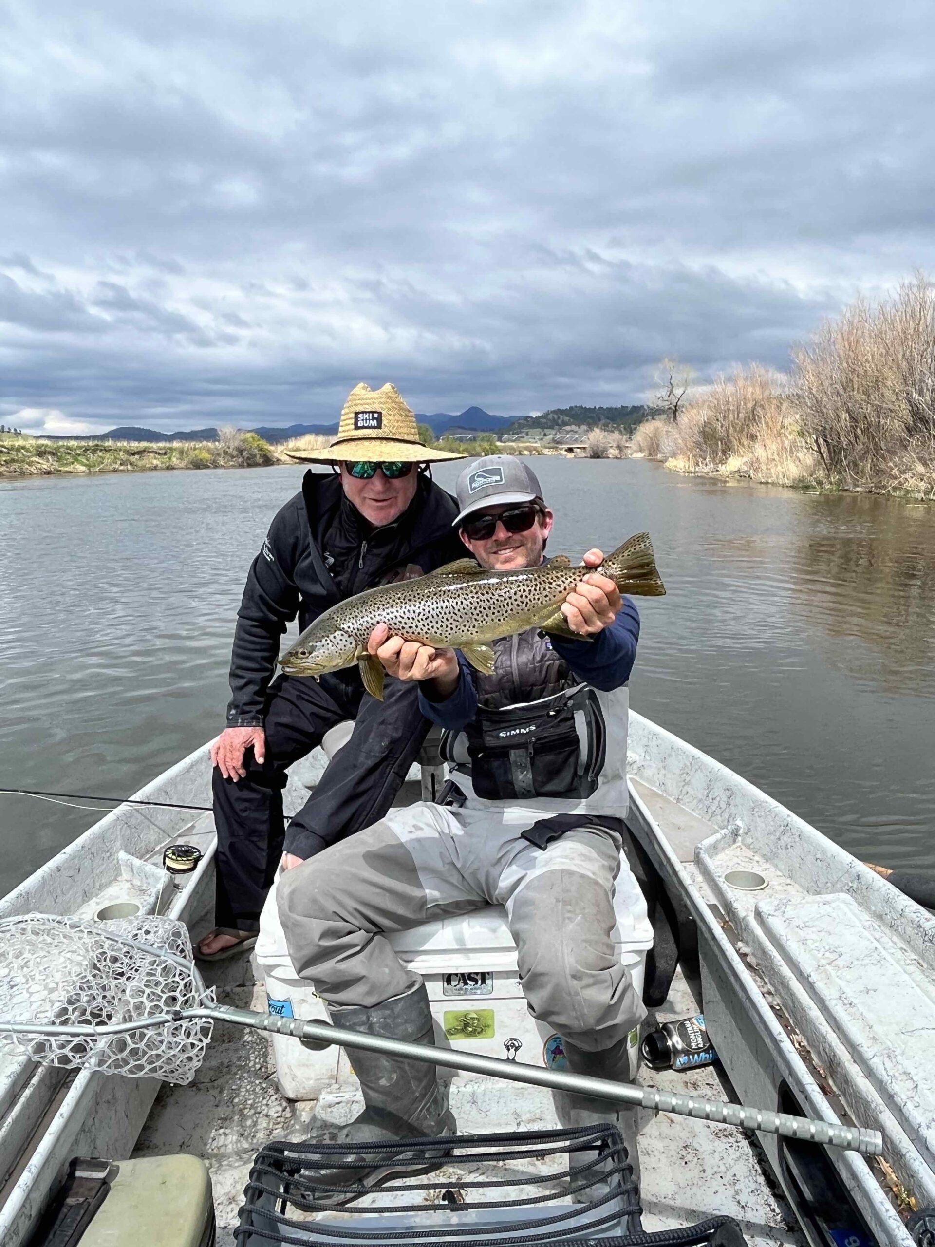 Angler with brown trout in Bozeman, MT