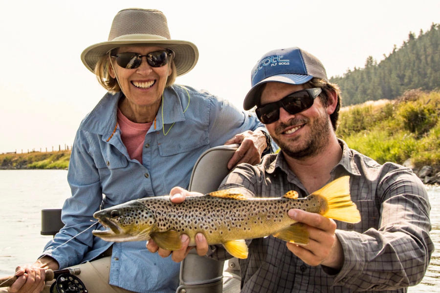 Angler and Fly Fishing Guide with a Yellowstone Brown Trout