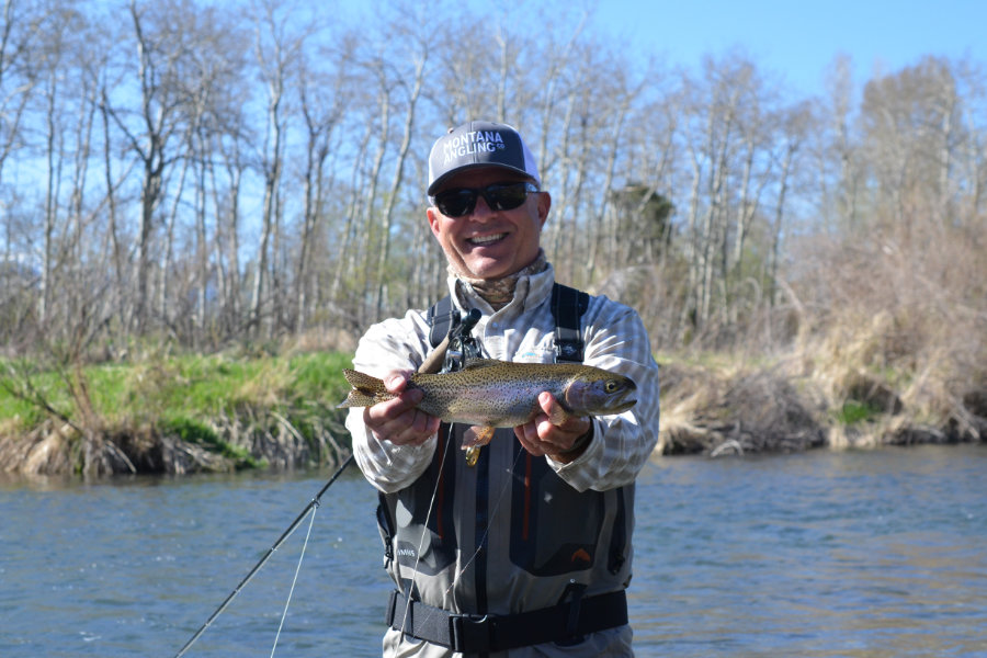 Angler holding a rainbow trout on DePuy's Spring Creek in Montana