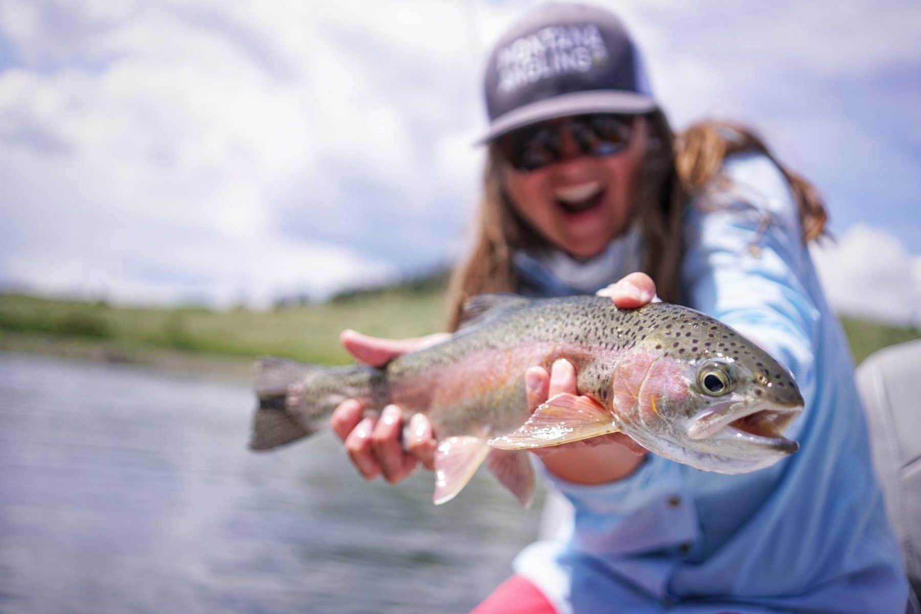 angler with a Missouri River rainbow trout