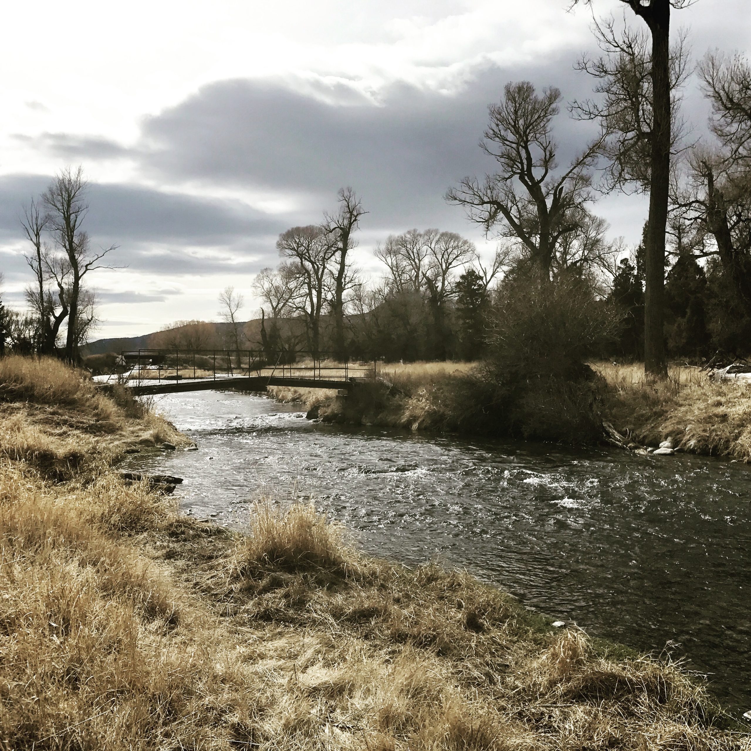 montana river in november with bridge over it